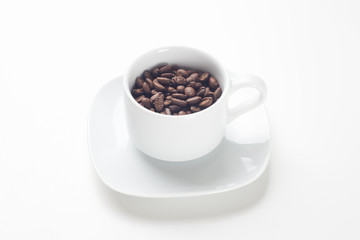 Coffee cup with coffee beans
