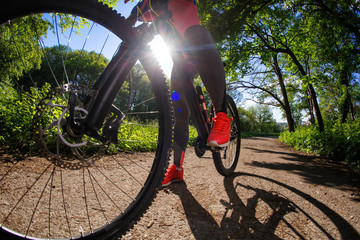 cyclist woman riding a bicycle in park