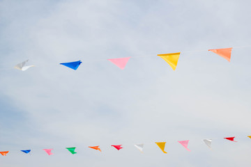 festive bunting flags against a blue sky background