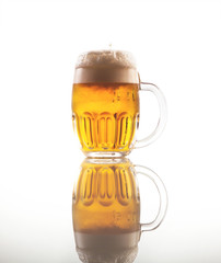 Full glass of beer with foam