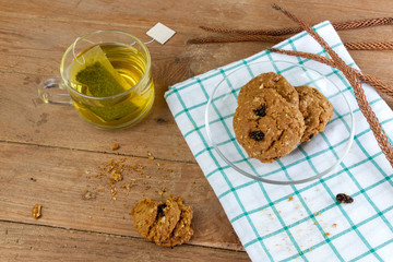 Cup glass of green tea and cookies