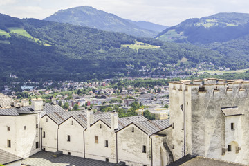 Fototapeta na wymiar background landscape view of the walls of Hohensalzburg Fortress and the surrounding mountains in Salzburg, Austria