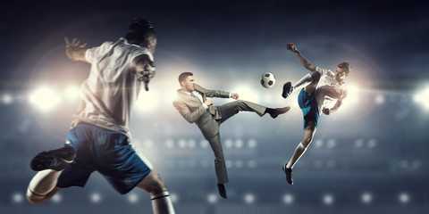 Fototapeta na wymiar Businessman and player fighting for ball