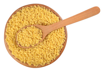 Uncooked italian pasta stars in a wooden bowl on a white
