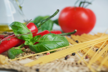 Italian food background, with  tomatoes, basil, spaghetti, olive