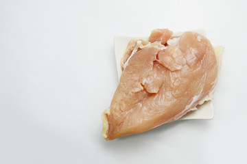 chicken for cooking on white plast