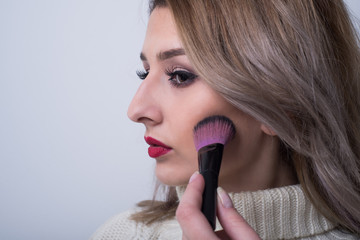 girl with makeup brush 