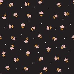 Delicate pattern in a small flower. Black background.