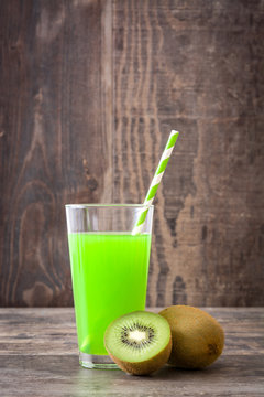 Kiwi smoothie on a rustic wooden background
