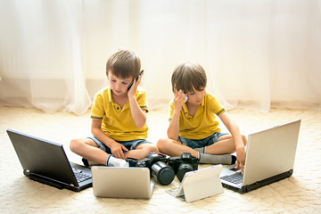 Two boys, preschool children, having fun playing at home with co