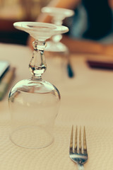 Close up on a wine glass on a table natural light background