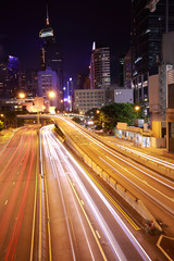 Fototapeta na wymiar HK of City car with light trails of modern urban buildings