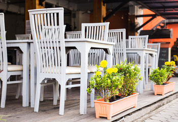 Fototapeta na wymiar Table and chairs outdoors