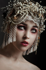 Girl zombie with beautiful vintage decorated hat