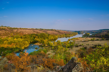 Rural autumn sunrise landscape with river and  colorful trees, seasonal background