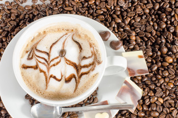 Good Morning: Cup of latte art coffee with coffee beans :)