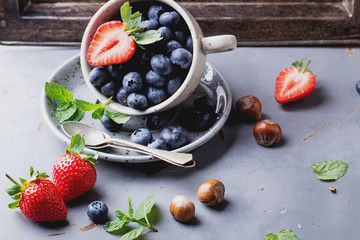 Strawberries and Blueberries on metal background