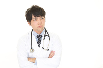Fototapeta premium 考え事をする医師