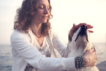 owner caressing gently her dog