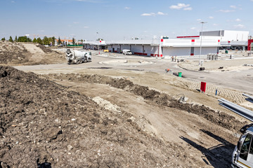 Concrete mixer passing over construction site