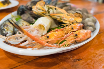 Seafood on white dish,