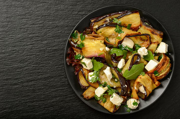 Appetizer - delicious salad with  grilled eggplants with feta cheese, parsley and rucola.
