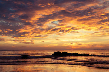 Naklejka na ściany i meble Colorful dawn over the sea.
