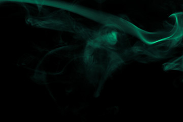 Cloud of smoke on black background. Defocused. Toned