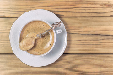 Coffee with foam in vintage mug