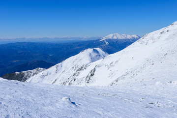 Fototapeta na wymiar Mt.Ontake and Ridge line of the Central Japan Alps in winter in Nagano, Japan