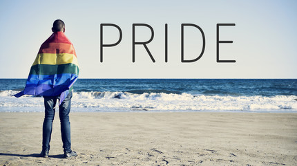 text pride and a man wrapped in a rainbow flag