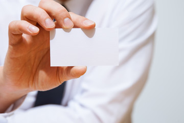 Businessman holding  a business card