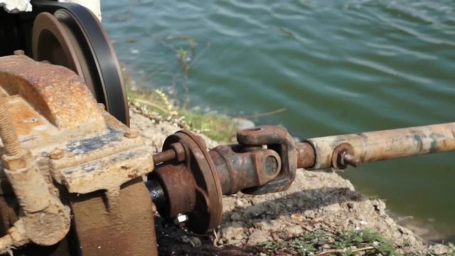 Diesel Engine turning drive shaft and piston rod for driving water turbines in fish pond.