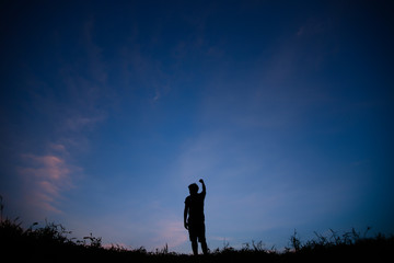 Fototapeta premium Silhouette of man and beautiful sky.