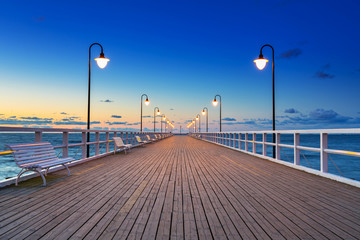Wooden pier in Gdynia Orlowo at sunrise, Poland