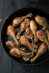 Fried chicken legs with spices and rosemary