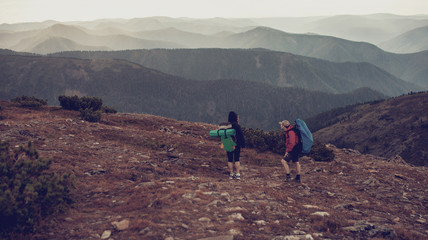 tourists look far for beautiful panorama of the mountains