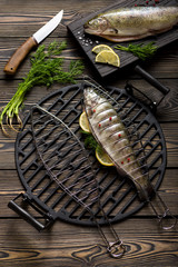 Fresh whole trout fishes prepared to grill top view