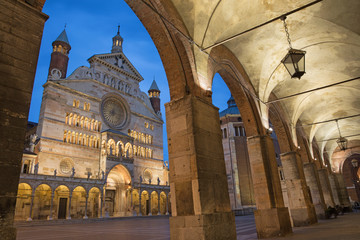 Cremona - The cathedral  Assumption of the Blessed Virgin Mary  and the portico of the Town hall at dusk. - obrazy, fototapety, plakaty