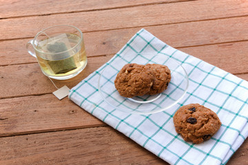 Cup glass of green tea and cookies