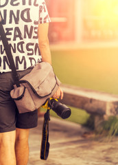 Obraz na płótnie Canvas Close up of man holding a camera ready to take a photograph