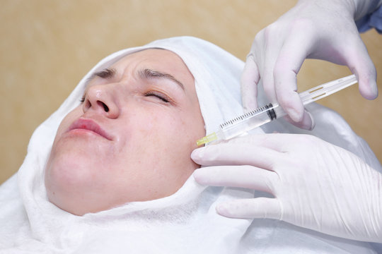 Cosmetic treatment with anti-age mixture injection