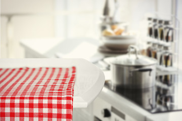 Wooden table and blurred kitchen background