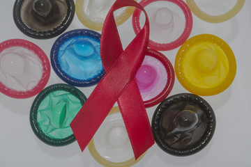 colorful condoms with red bow