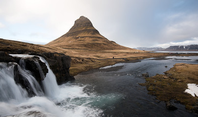 Fototapeta na wymiar Kirkjufellsfoss waterfalls and Kirkjufell mountain Iceland