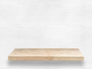 wooden shelf on white brick wall background