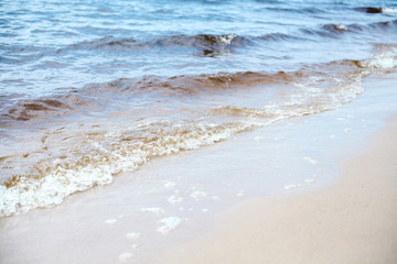 Waves. Sand. Sea. Outdoor recreation concept. Summer background.