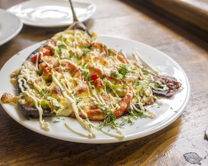 plate of food close up on wooden table outdoor cafe in Abkhazia