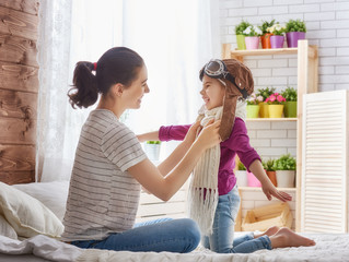 Mother and child girl playing