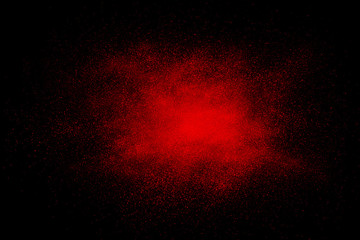 Red abstract powder explosion on a black background - 112863065